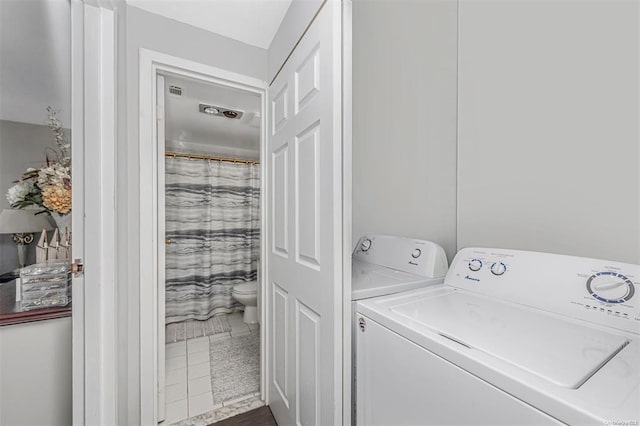 laundry area featuring tile patterned flooring