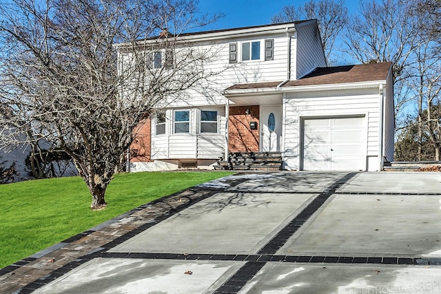 view of front property featuring a front yard and a garage