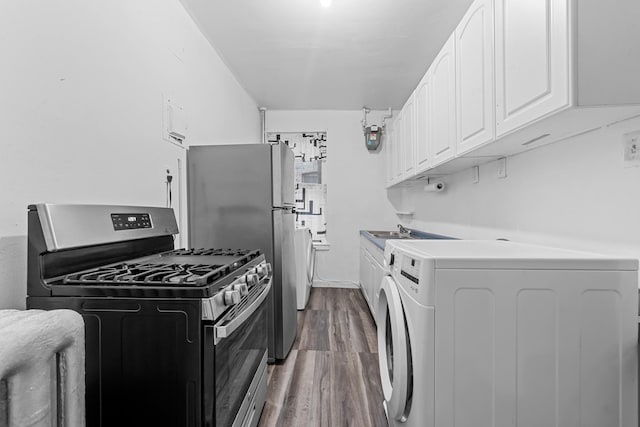 kitchen featuring washer / clothes dryer, white cabinetry, stainless steel appliances, and dark wood-type flooring