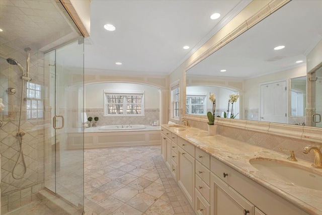 bathroom featuring decorative backsplash, ornamental molding, shower with separate bathtub, and vanity