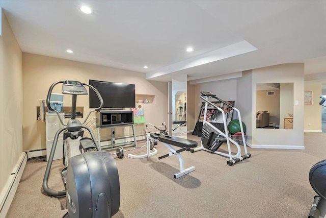 workout room with a baseboard heating unit