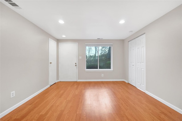 empty room with light wood-type flooring