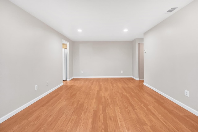 unfurnished room with light hardwood / wood-style flooring