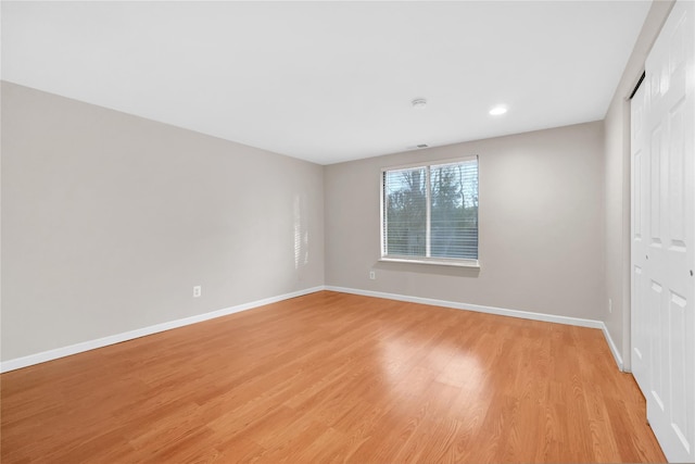 spare room with light wood-type flooring