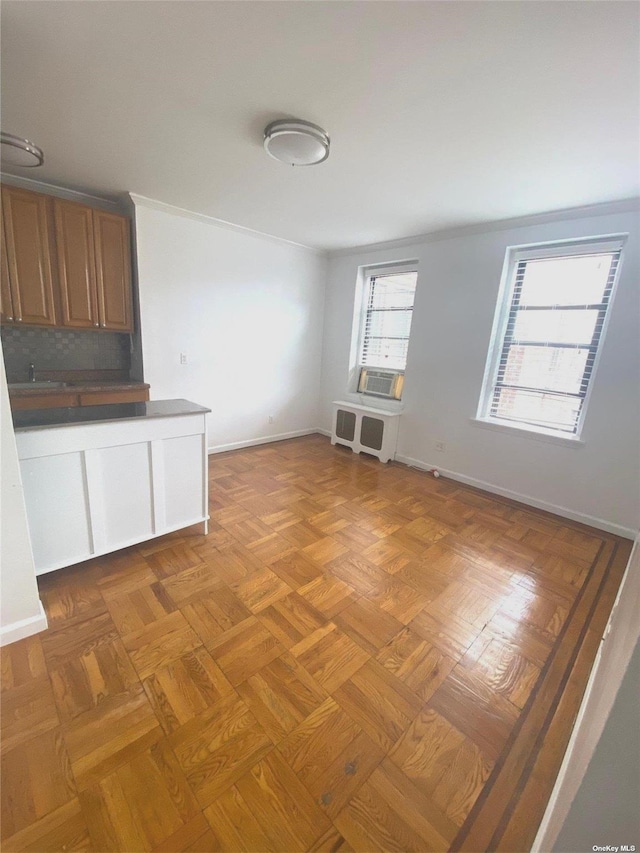 interior space with cooling unit, parquet floors, and sink