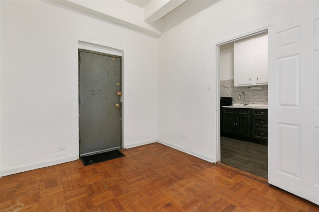 interior space featuring sink and parquet floors