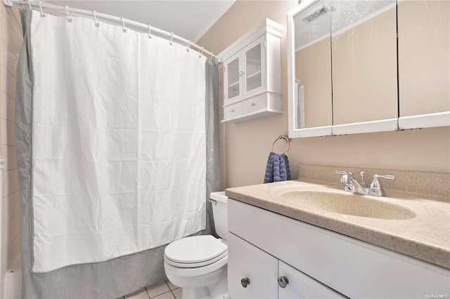 bathroom featuring tile patterned flooring, vanity, toilet, and shower / bathtub combination with curtain