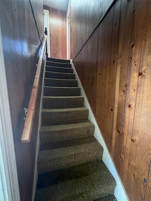 stairs with wood walls