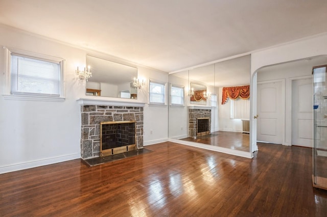 unfurnished living room featuring ornamental molding, a fireplace, and hardwood / wood-style floors