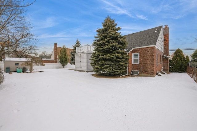 exterior space with a storage shed