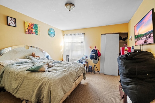 bedroom featuring light carpet