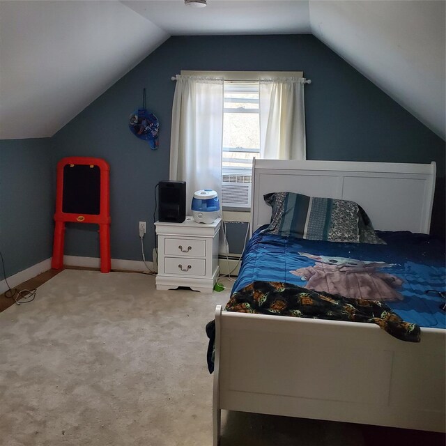 bedroom with baseboard heating, carpet flooring, and vaulted ceiling