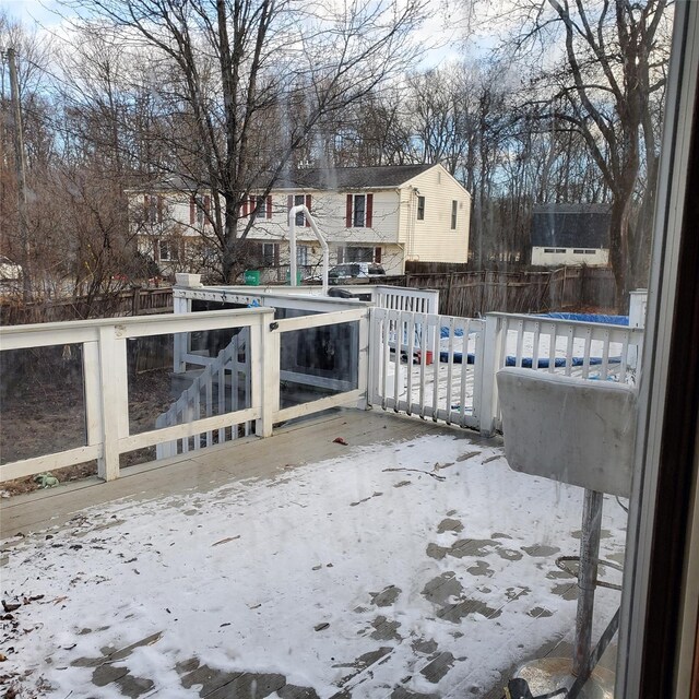 view of snow covered deck