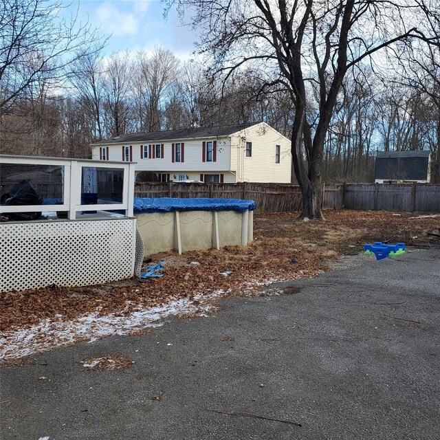 view of front facade with a covered pool