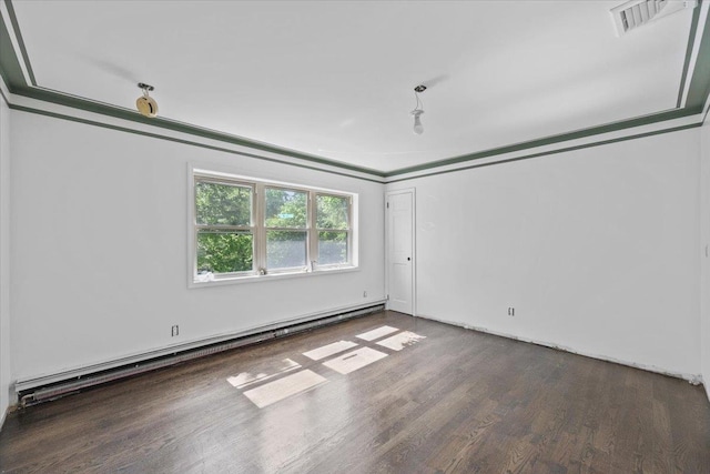 spare room with dark wood-type flooring and a baseboard radiator