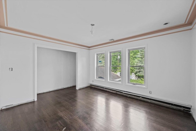 interior space featuring dark wood-type flooring, baseboard heating, and ornamental molding