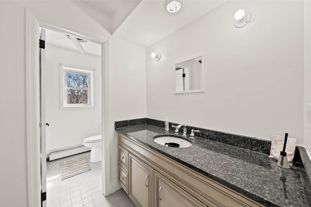 bathroom with vanity, toilet, and a baseboard radiator