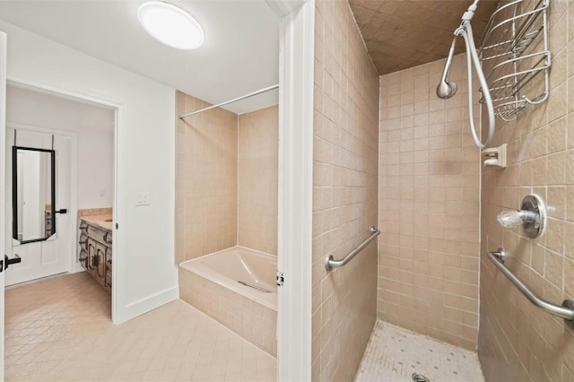 bathroom featuring tile patterned flooring, vanity, and separate shower and tub