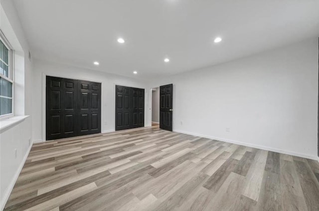 unfurnished bedroom with light hardwood / wood-style floors