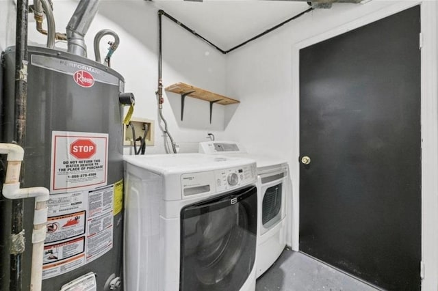 washroom with water heater and independent washer and dryer