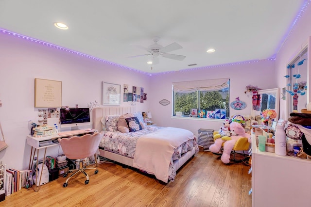 bedroom with light hardwood / wood-style flooring and ceiling fan