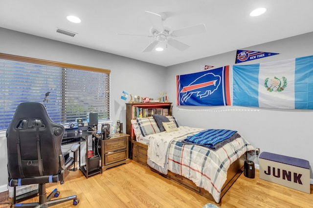 bedroom featuring light hardwood / wood-style flooring and ceiling fan