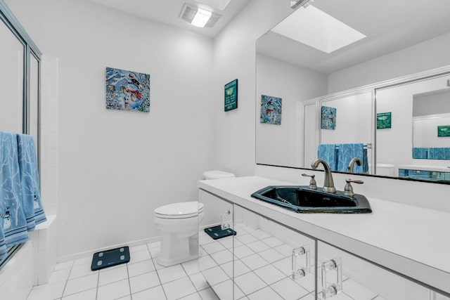 full bathroom featuring tile patterned flooring, a skylight, sink, bath / shower combo with glass door, and toilet