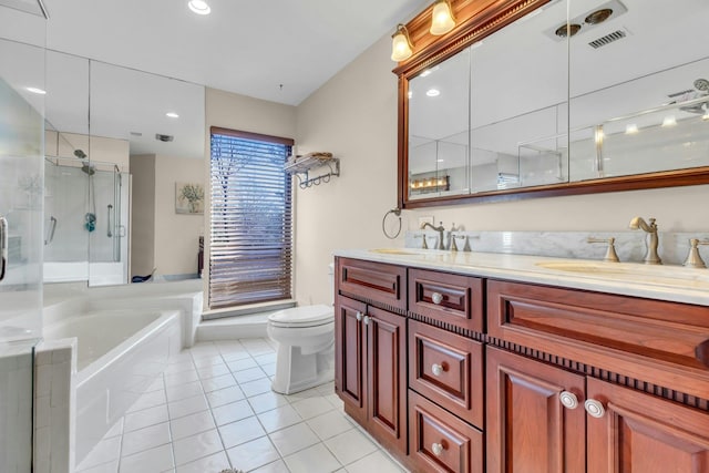 full bathroom featuring toilet, tile patterned floors, shower with separate bathtub, and vanity