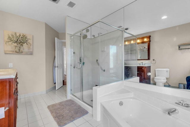 full bathroom featuring vanity, toilet, shower with separate bathtub, and tile patterned floors