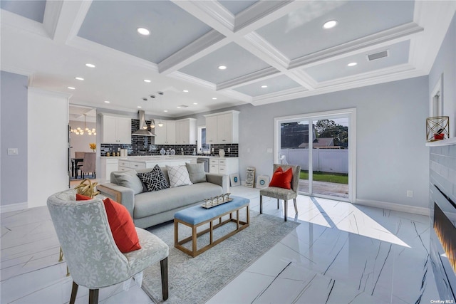 living room with beamed ceiling, ornamental molding, an inviting chandelier, and coffered ceiling