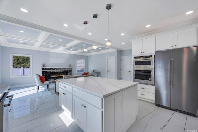 kitchen featuring coffered ceiling, a kitchen island, beam ceiling, white cabinetry, and stainless steel appliances