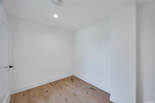 spare room with light hardwood / wood-style flooring