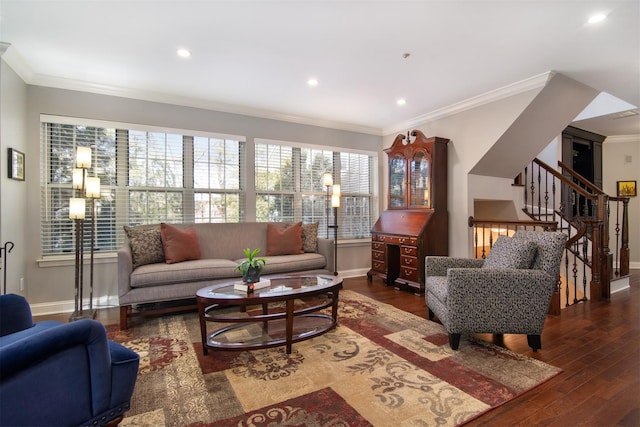 living room with ornamental molding and dark hardwood / wood-style flooring