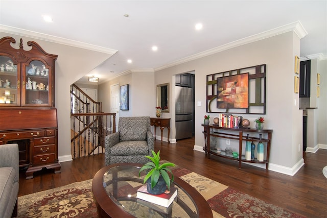 living room featuring dark hardwood / wood-style flooring and crown molding