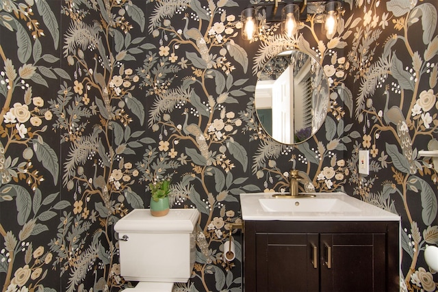 bathroom featuring vanity and toilet