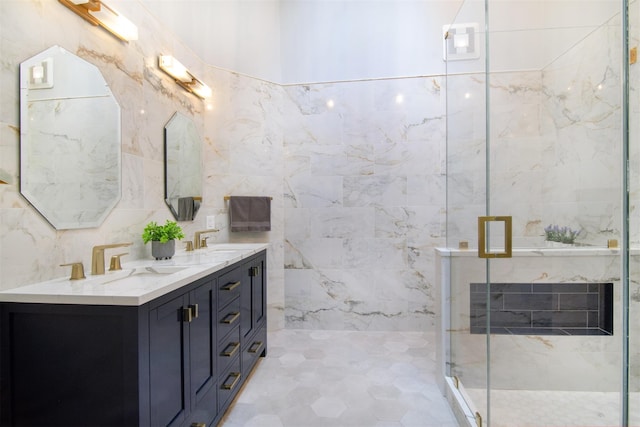 bathroom with an enclosed shower, vanity, and tile walls