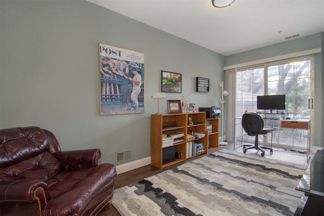 office area with hardwood / wood-style flooring