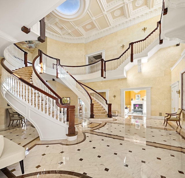 entryway featuring a high ceiling and crown molding