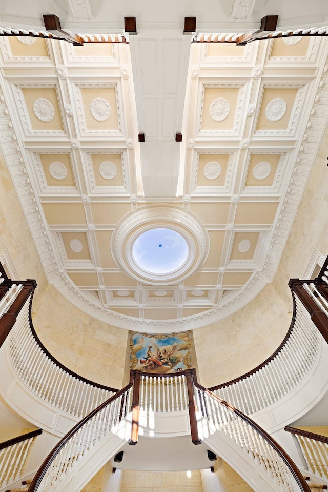 staircase with a towering ceiling