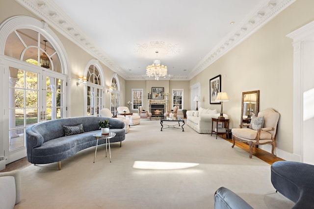 carpeted living room featuring a healthy amount of sunlight, crown molding, and french doors