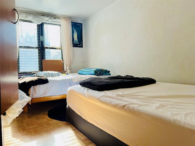 bedroom with parquet flooring