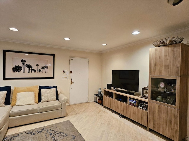 living room with light wood-type flooring and ornamental molding