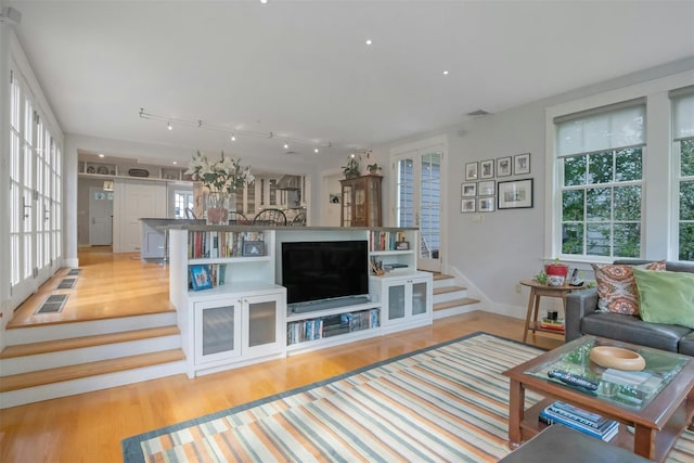 living room with light hardwood / wood-style flooring