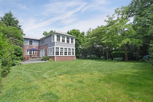 view of yard with a sunroom