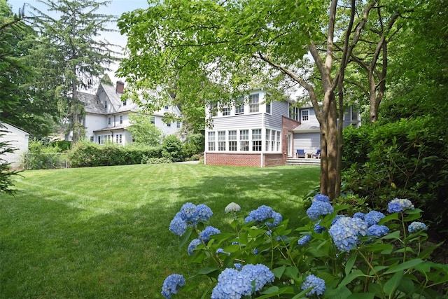 view of yard featuring a sunroom