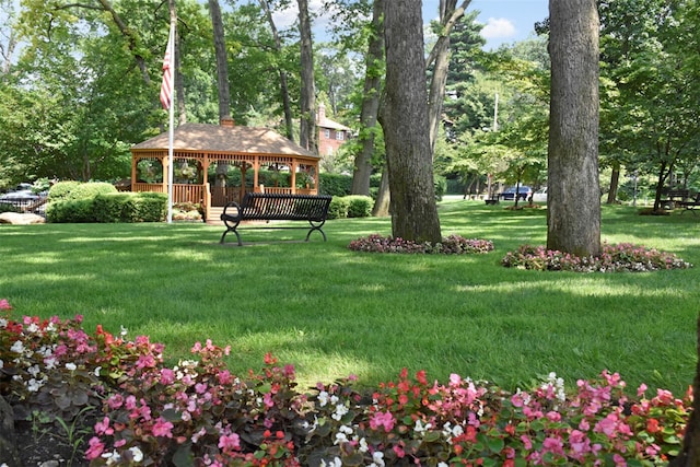 surrounding community featuring a gazebo and a yard