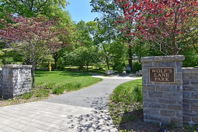 view of property's community with a lawn