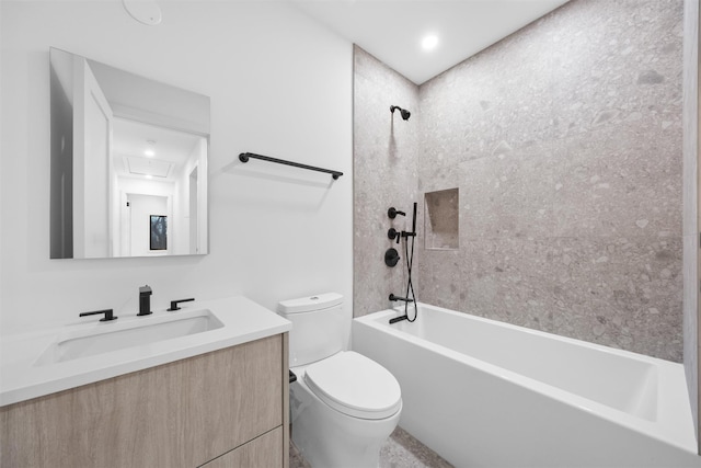 full bathroom with vanity, toilet, and tiled shower / bath combo