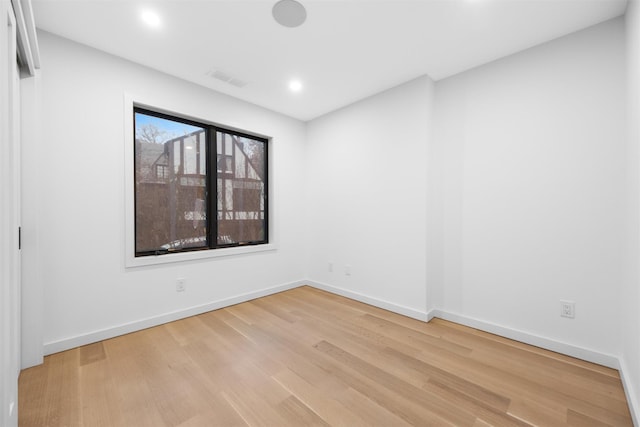 spare room featuring light hardwood / wood-style flooring