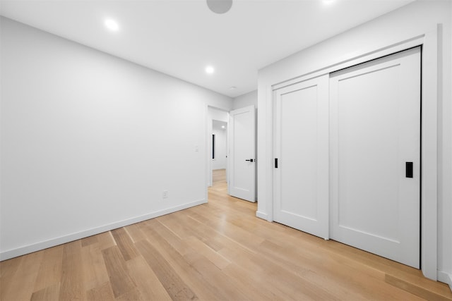 unfurnished bedroom with light hardwood / wood-style floors